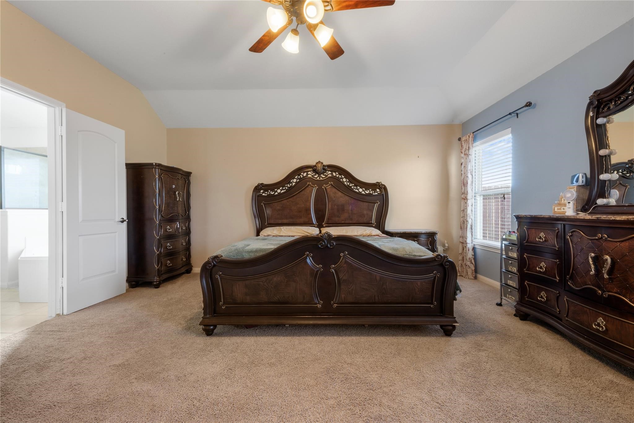 22907 Gentle Shadow Drive Hockley, TX 77447 - Photo 12 of 27 a bedroom with a bed and a mirror