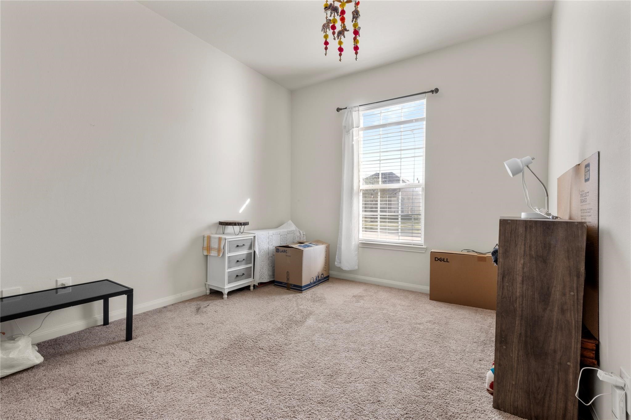 22907 Gentle Shadow Drive Hockley, TX 77447 - Photo 17 of 27 a living room with furniture and a window