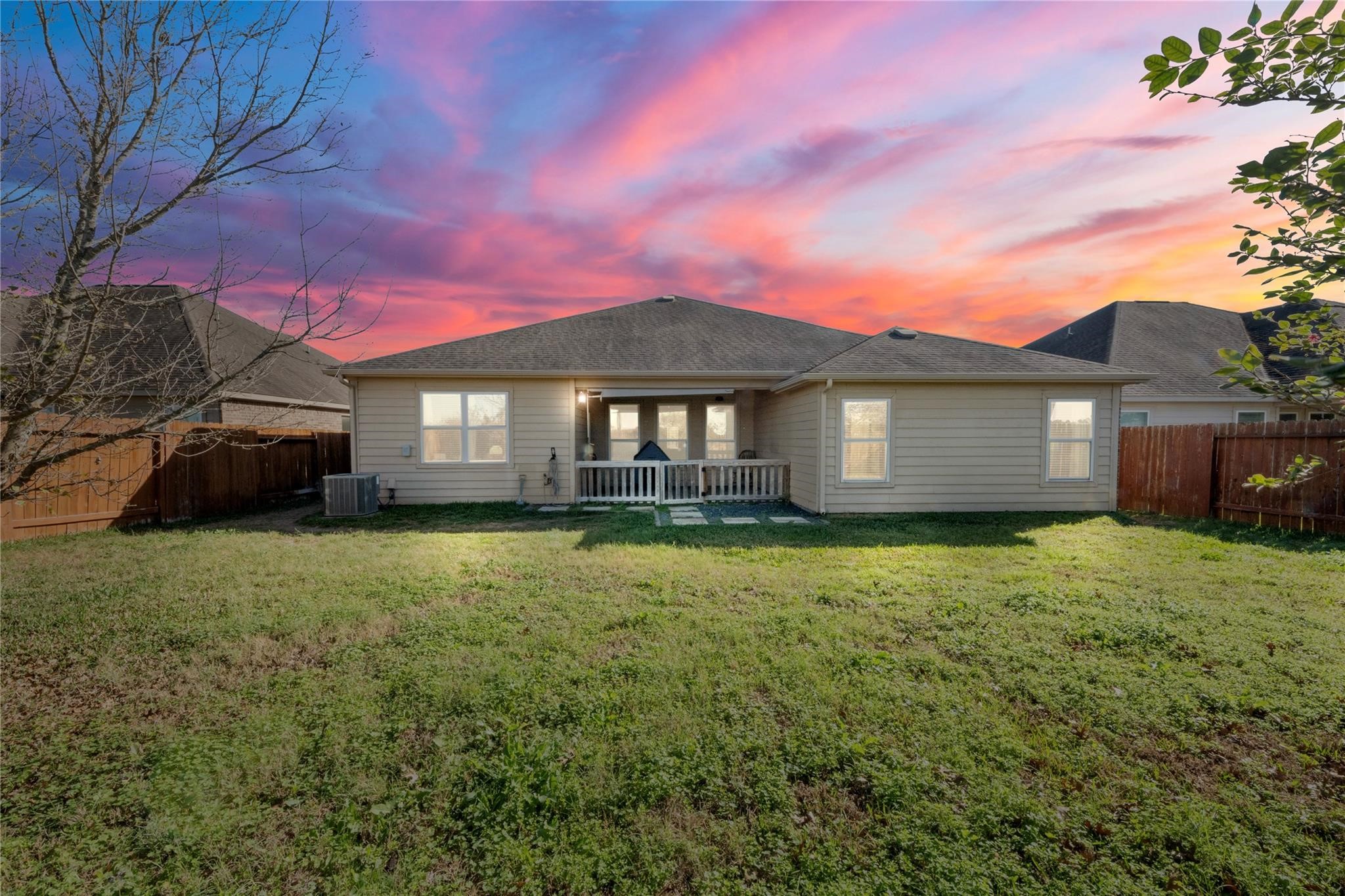 22907 Gentle Shadow Drive Hockley, TX 77447 - Photo 24 of 27 a front view of a house with a garden