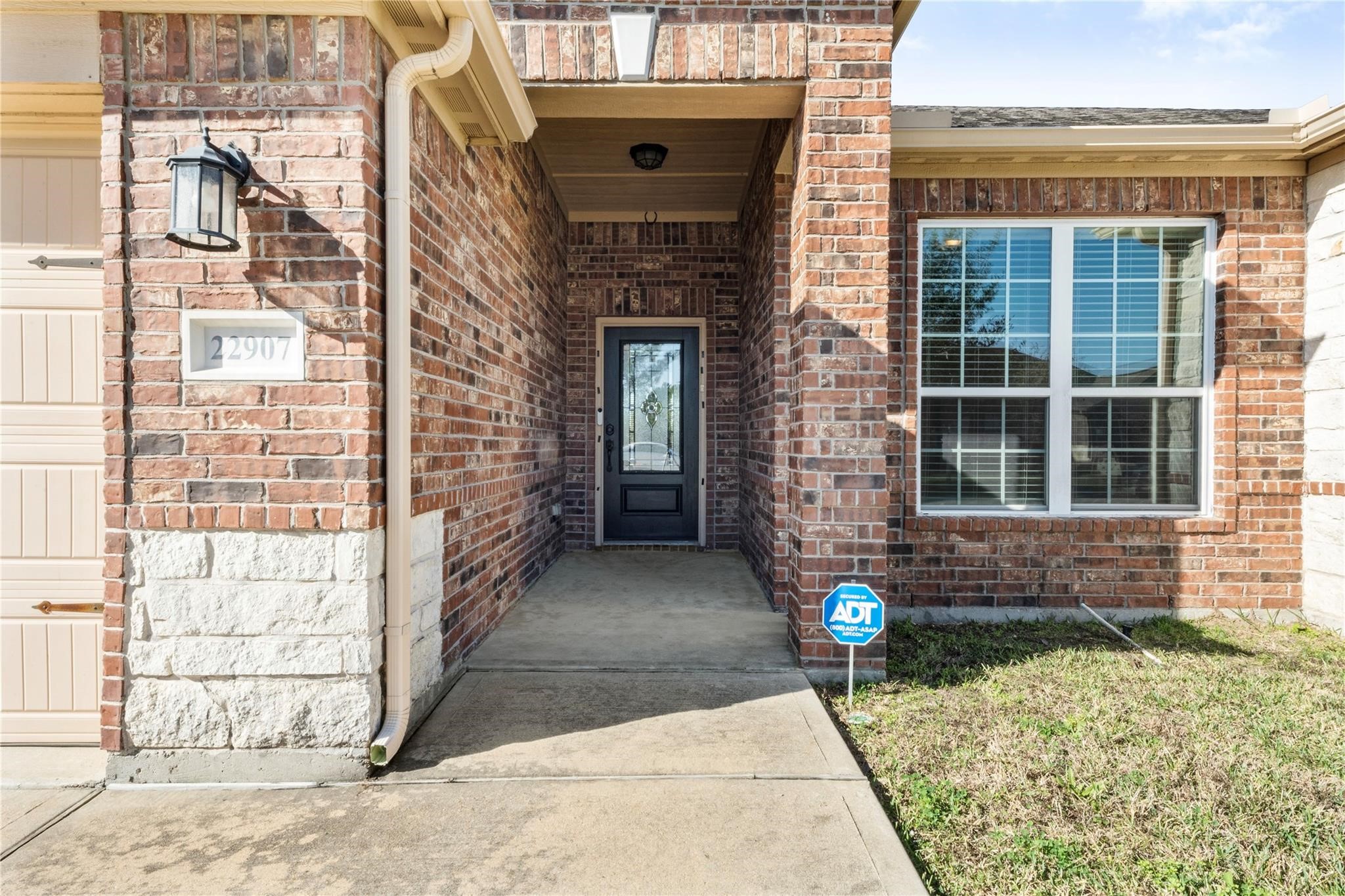 22907 Gentle Shadow Drive Hockley, TX 77447 - Photo 3 of 27 a front view of a house with parking