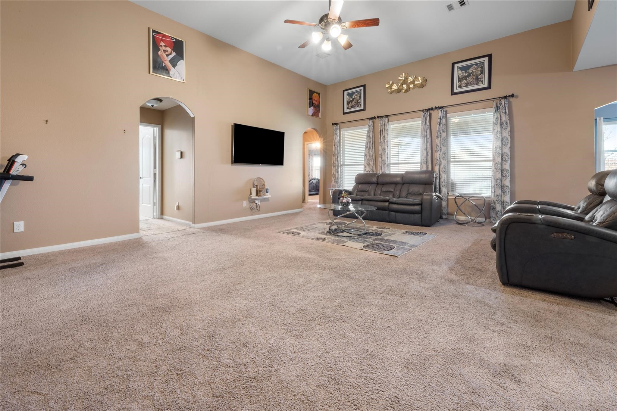22907 Gentle Shadow Drive Hockley, TX 77447 - Photo 6 of 27 a living room with furniture and a flat screen tv