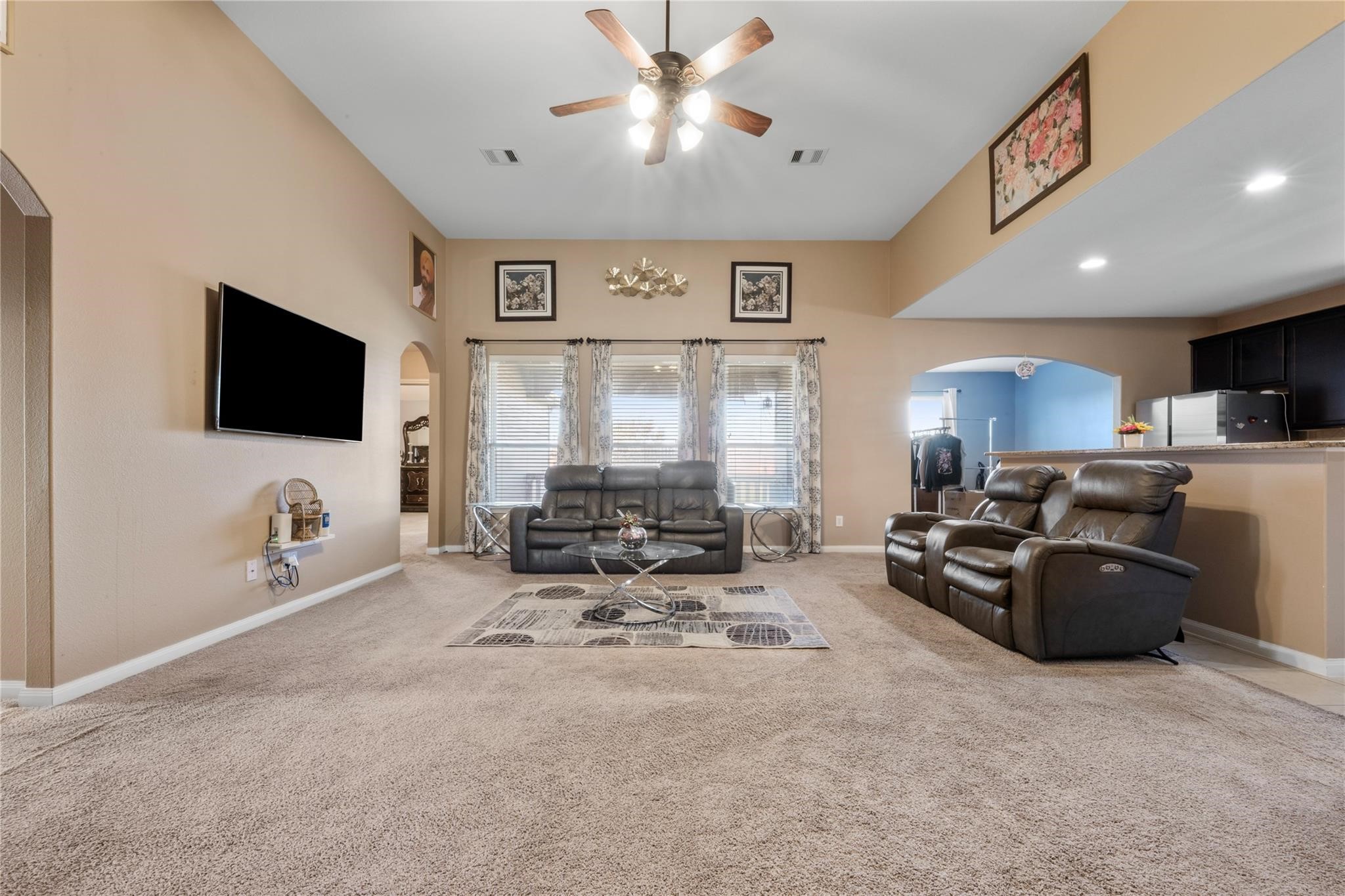 22907 Gentle Shadow Drive Hockley, TX 77447 - Photo 7 of 27 a living room with furniture and a flat screen tv