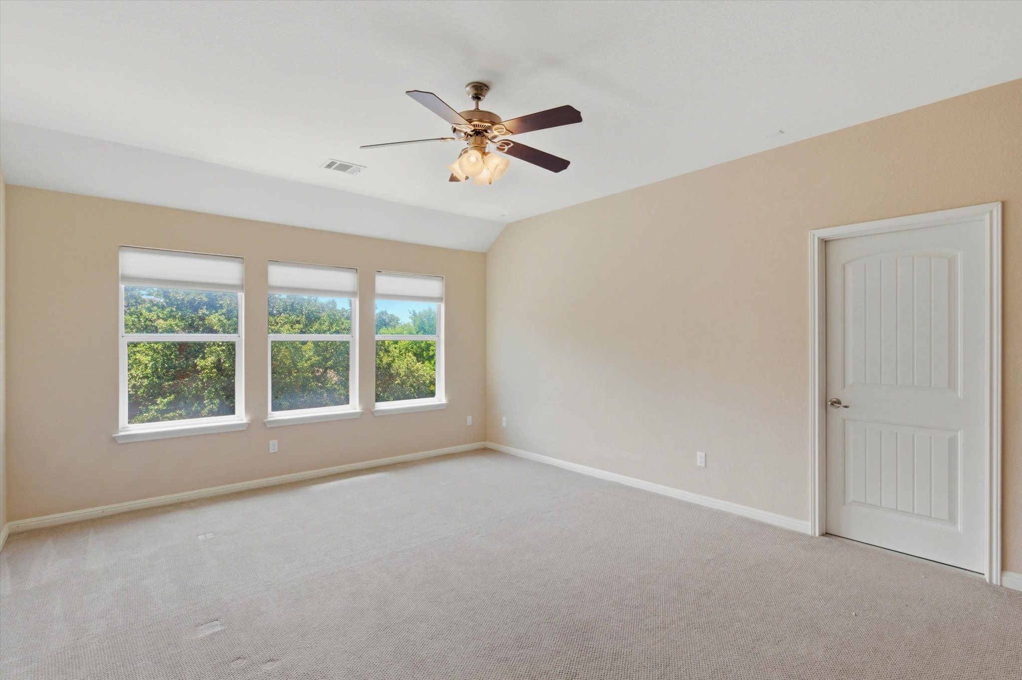 1511 Rimstone Drive Cedar Park, TX 78613 - Photo 24 of 39 A quiet retreat with treetop views, this spacious bedroom offers serene living.