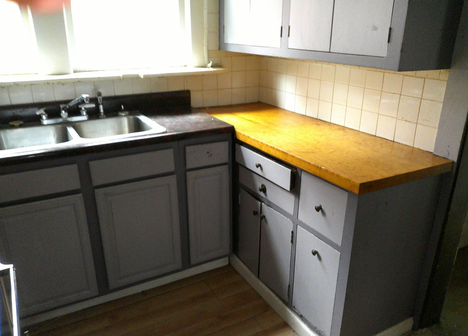 958 West William Street Decatur, IL 62522 - Photo 8 of 20 a kitchen with a sink and cabinets