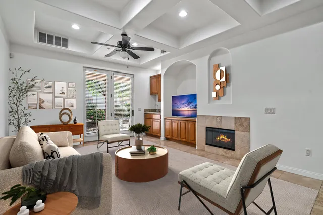 a living room with furniture potted plant and a fireplace