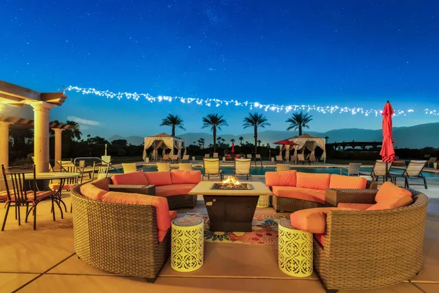 a view of swimming pool with lounge chair