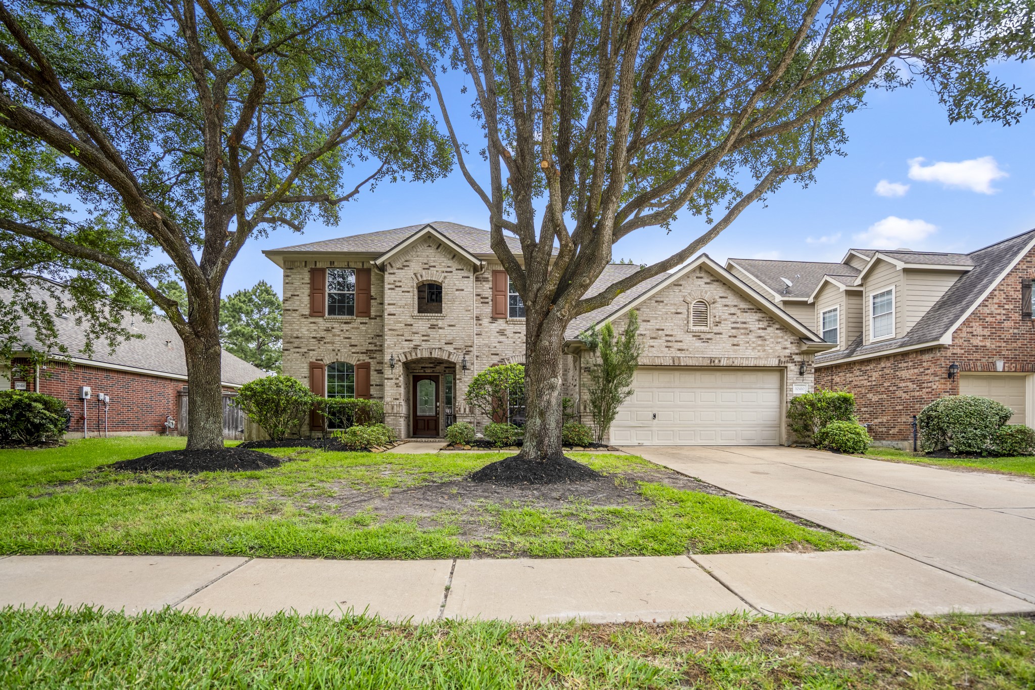 10410 Pitcataway Drive Spring, TX 77379 - Photo 2 of 48 The grand arched established trees offer a welcoming front yard that leads to your beautiful new home.