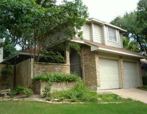 1707 Whitney Way Austin, TX 78741 - Photo 1 of 1 a front view of house with yard and trees