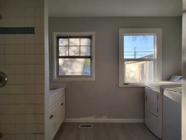 a view of kitchen with wooden floor