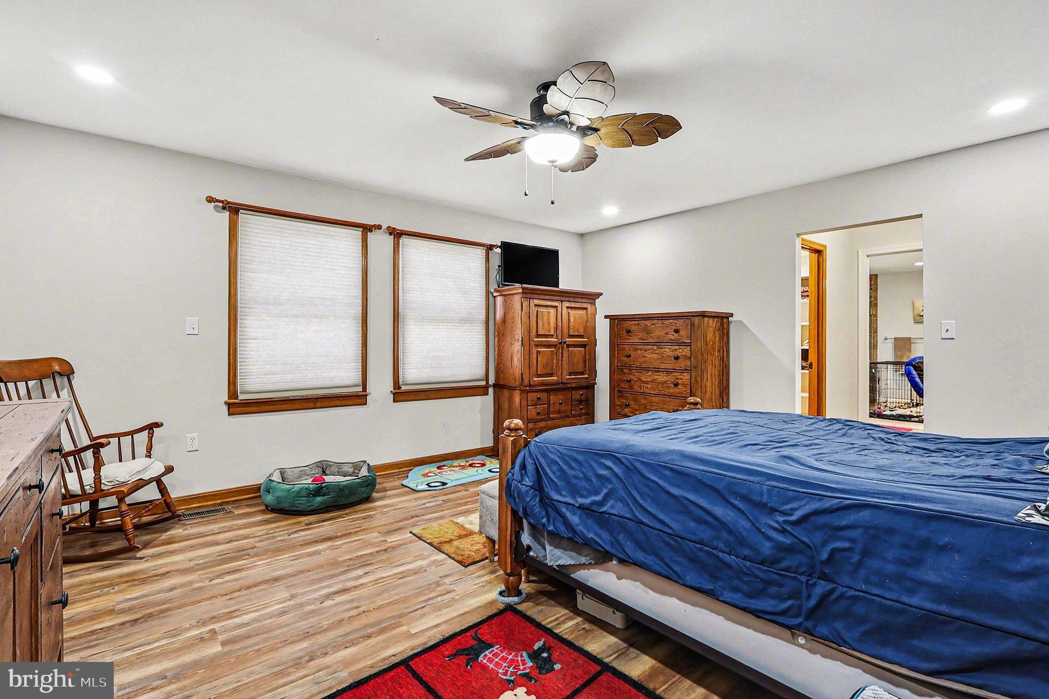 8318 Diamond Hill Road Warrenton, VA 20186 - Photo 12 of 88 a bedroom with a bed and wooden floor