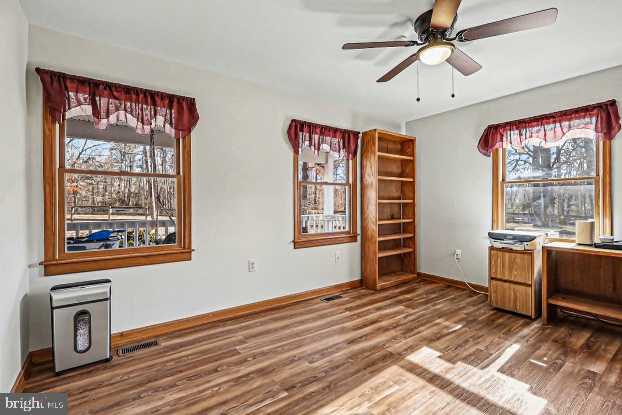 8318 Diamond Hill Road Warrenton, VA 20186 - Photo 19 of 88 a view of an empty room with a window and a dresser