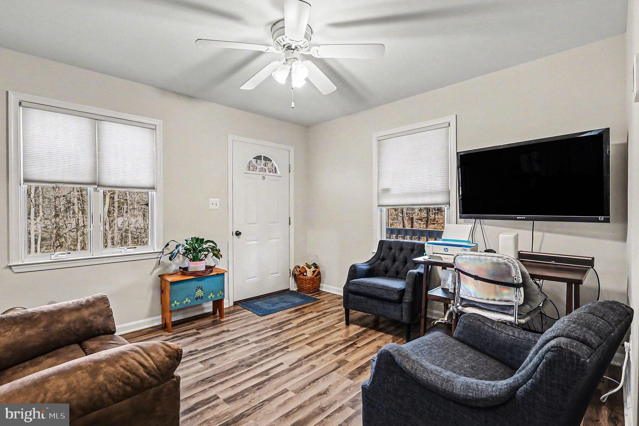 8318 Diamond Hill Road Warrenton, VA 20186 - Photo 22 of 88 a living room with furniture and a flat screen tv
