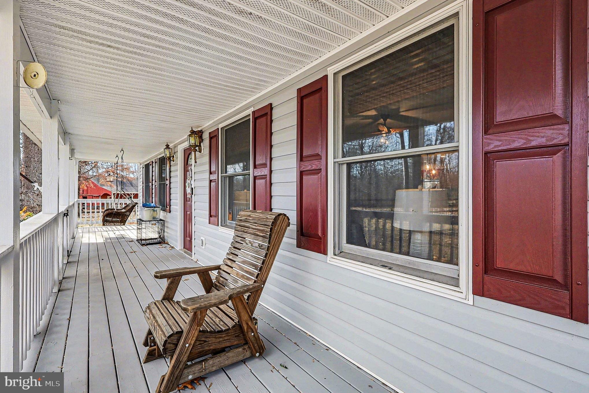 8318 Diamond Hill Road Warrenton, VA 20186 - Photo 27 of 88 a view of a patio with table and chairs with wooden floor and fence