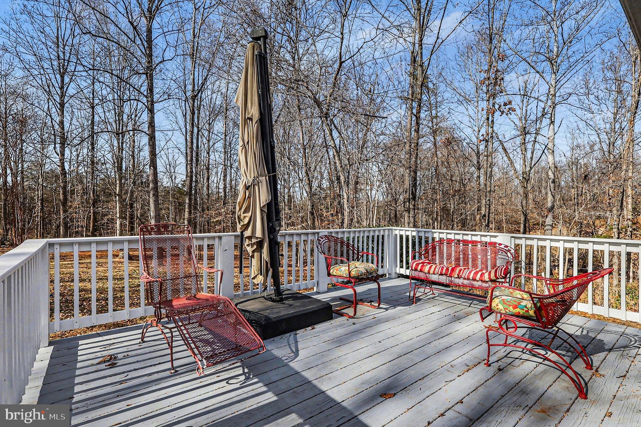 8318 Diamond Hill Road Warrenton, VA 20186 - Photo 3 of 88 Serene deck retreat amidst nature's embrace.