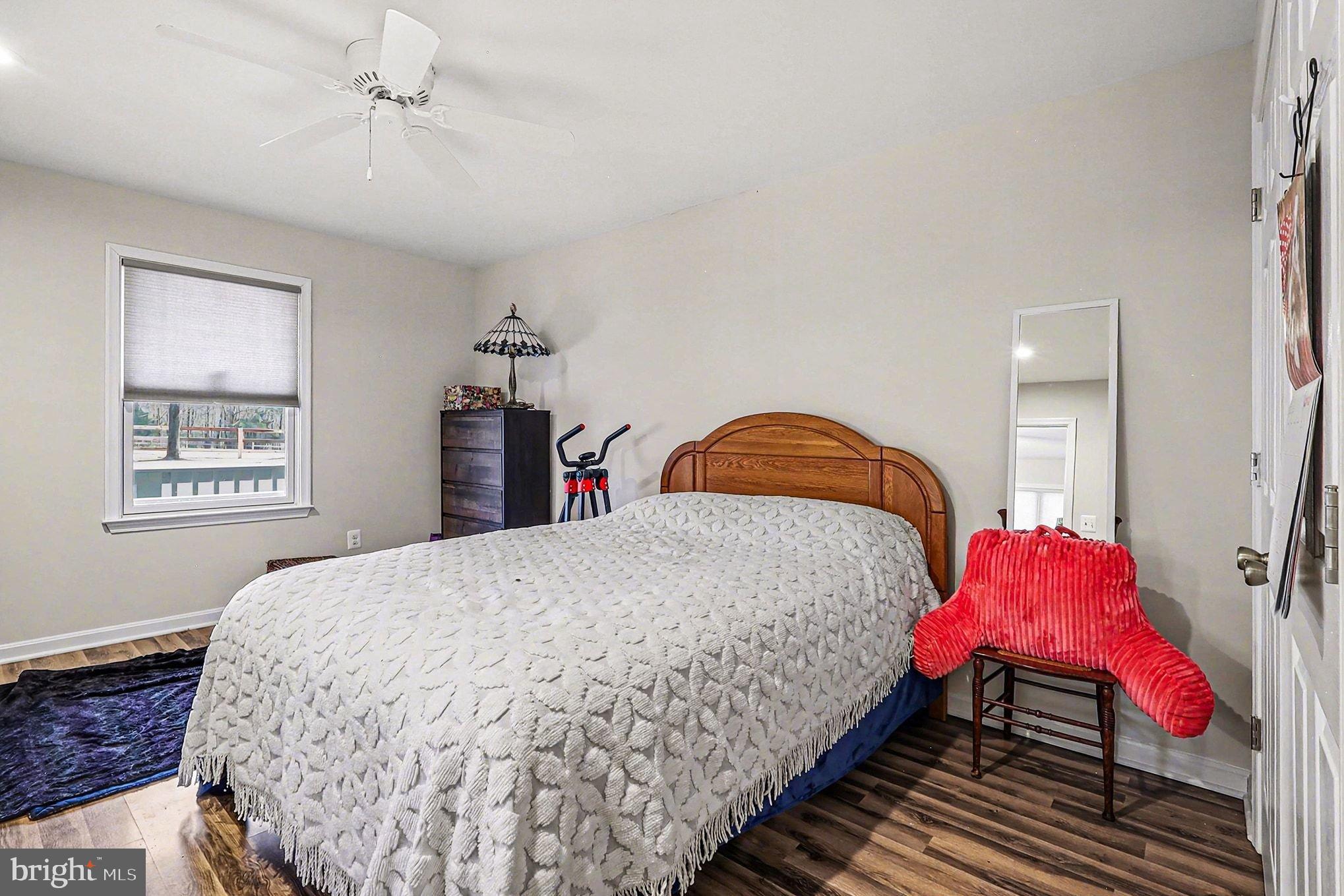 8318 Diamond Hill Road Warrenton, VA 20186 - Photo 32 of 88 a bedroom with a bed and window