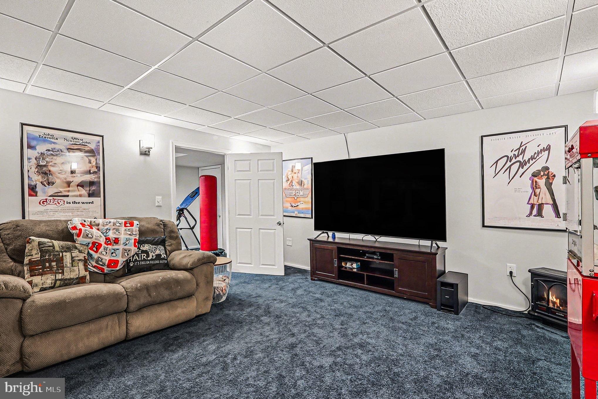 8318 Diamond Hill Road Warrenton, VA 20186 - Photo 36 of 88 a living room with furniture and a flat screen tv