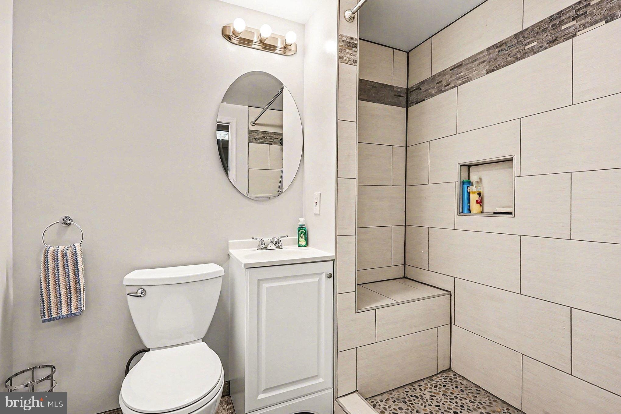 8318 Diamond Hill Road Warrenton, VA 20186 - Photo 47 of 88 a bathroom with a toilet sink and mirror
