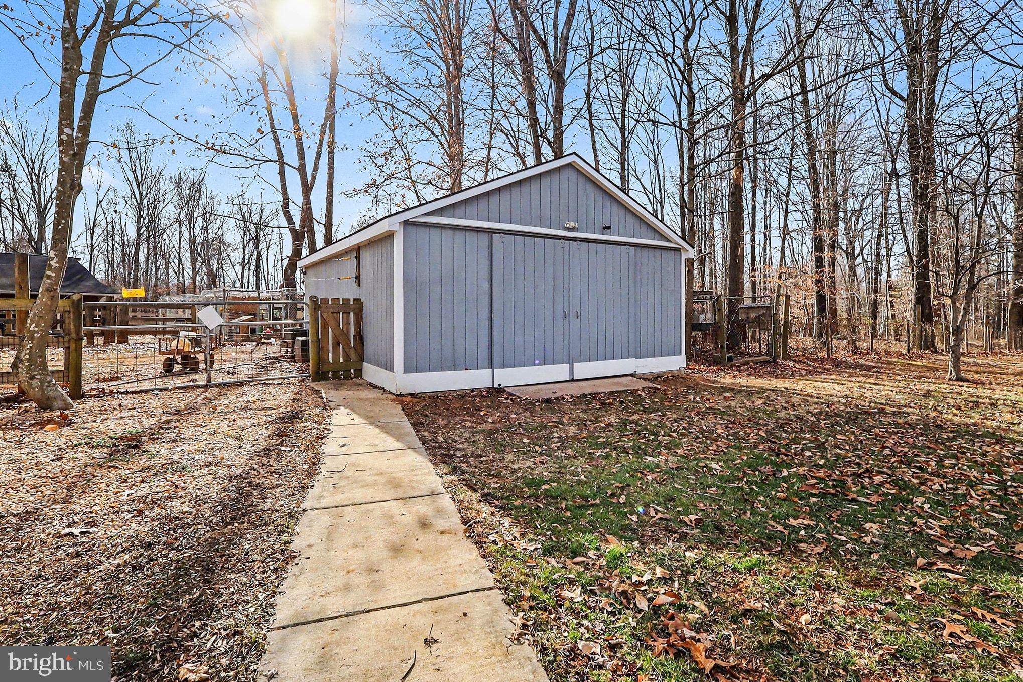 8318 Diamond Hill Road Warrenton, VA 20186 - Photo 59 of 88 Charming shed nestled in serene woods.