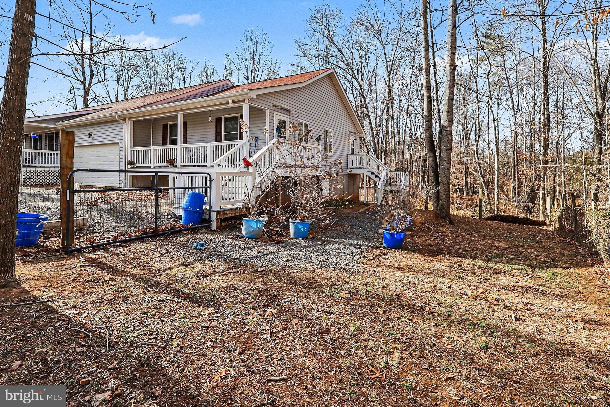 8318 Diamond Hill Road Warrenton, VA 20186 - Photo 64 of 88 a view of a house with a backyard and trees