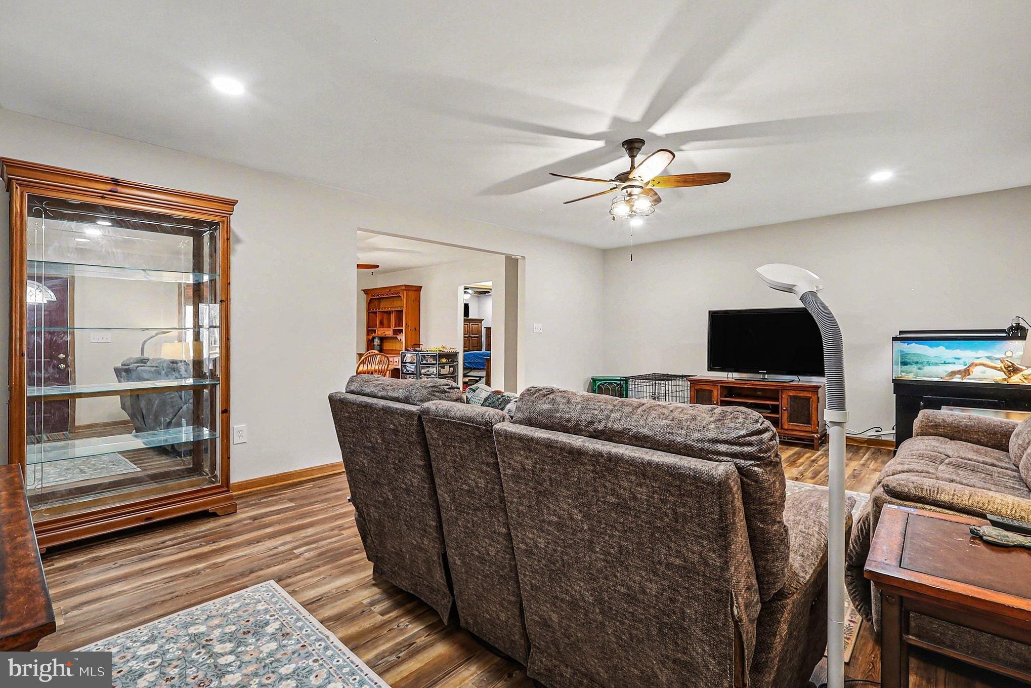 8318 Diamond Hill Road Warrenton, VA 20186 - Photo 10 of 88 a living room with furniture and a flat screen tv