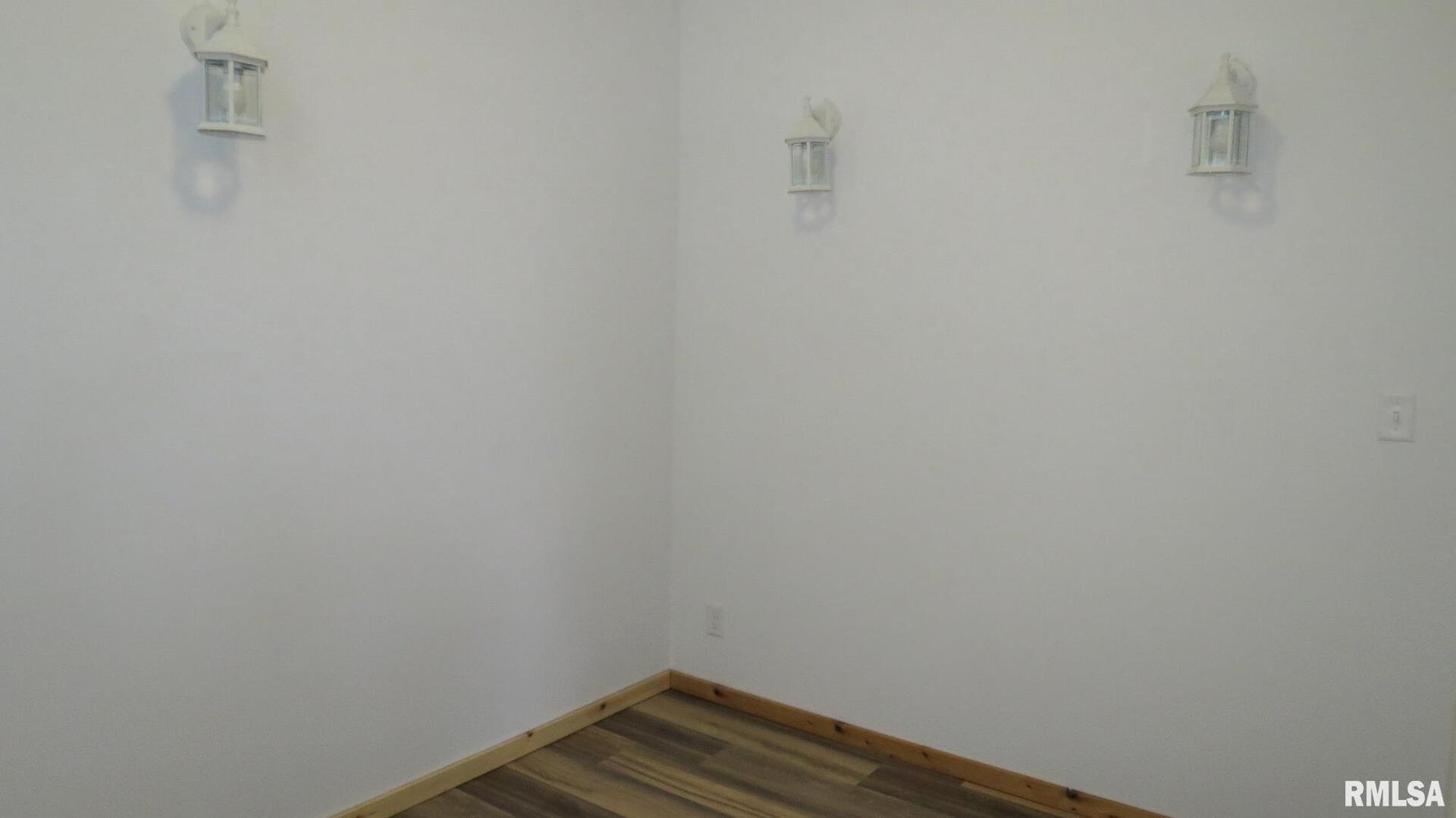 12 North Division Street Du Quoin, IL 62832 - Photo 14 of 21 a view of small space with empty racks on the wall