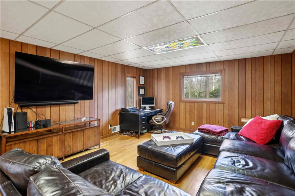 1605 Saint Tropez Way Atlanta, GA 30350 - Photo 12 of 29 a living room with furniture a flat screen tv and a window