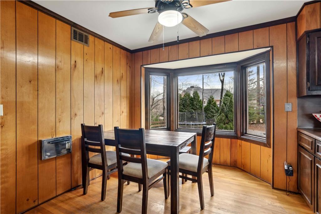 1605 Saint Tropez Way Atlanta, GA 30350 - Photo 15 of 29 a dining room with furniture window and wooden floor