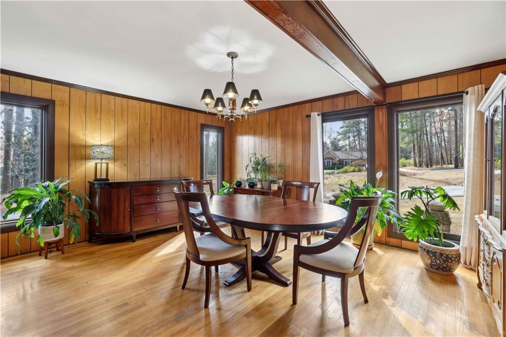 1605 Saint Tropez Way Atlanta, GA 30350 - Photo 16 of 29 a view of a dining room with furniture window and wooden floor
