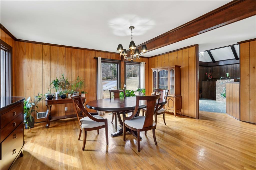 1605 Saint Tropez Way Atlanta, GA 30350 - Photo 17 of 29 a view of a dining room with furniture window and wooden floor