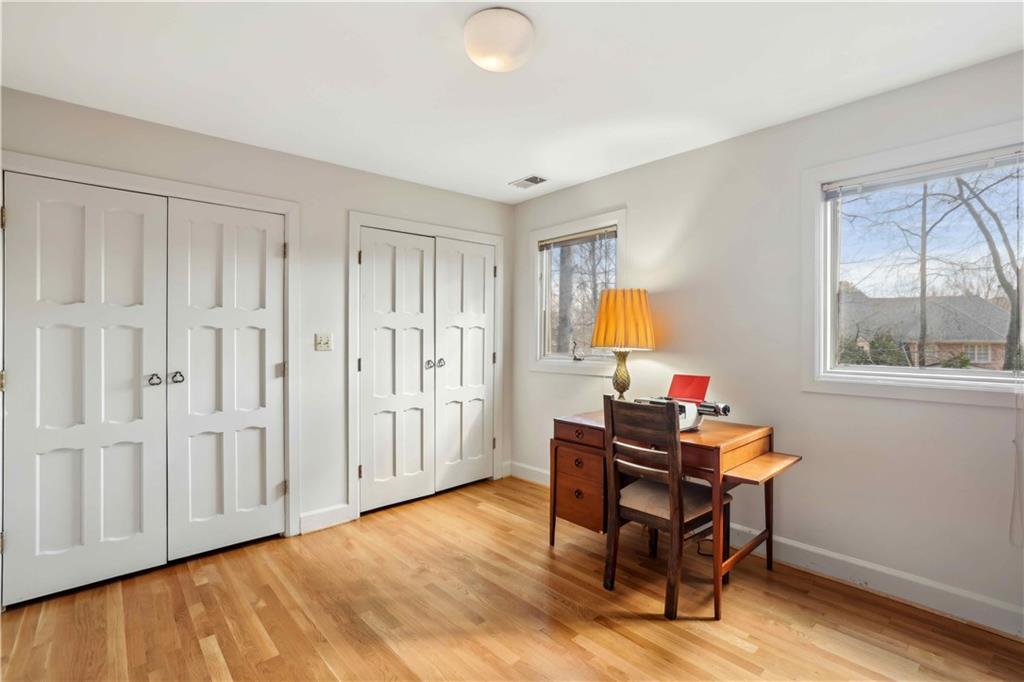 1605 Saint Tropez Way Atlanta, GA 30350 - Photo 25 of 29 a view of a workspace with furniture and a window