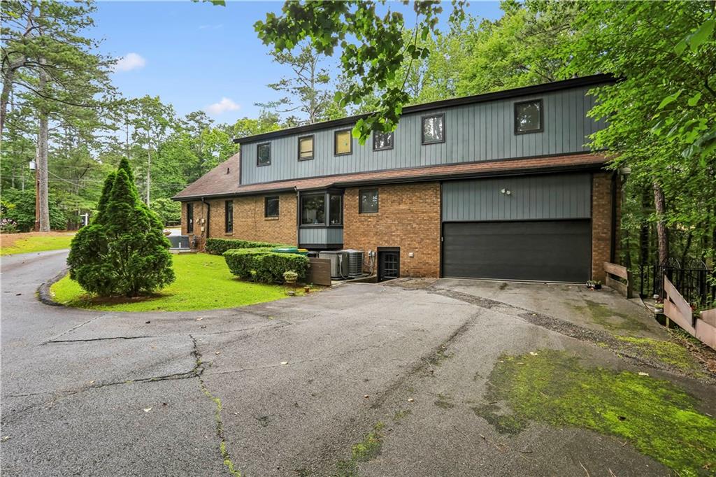 1605 Saint Tropez Way Atlanta, GA 30350 - Photo 26 of 29 a front view of a house with garden