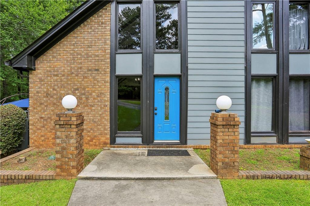 1605 Saint Tropez Way Atlanta, GA 30350 - Photo 4 of 29 a front view of a house with a yard