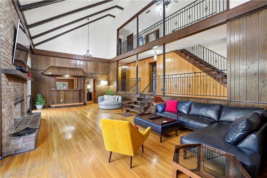 1605 Saint Tropez Way Atlanta, GA 30350 - Photo 8 of 29 a living room with furniture and a wooden floor