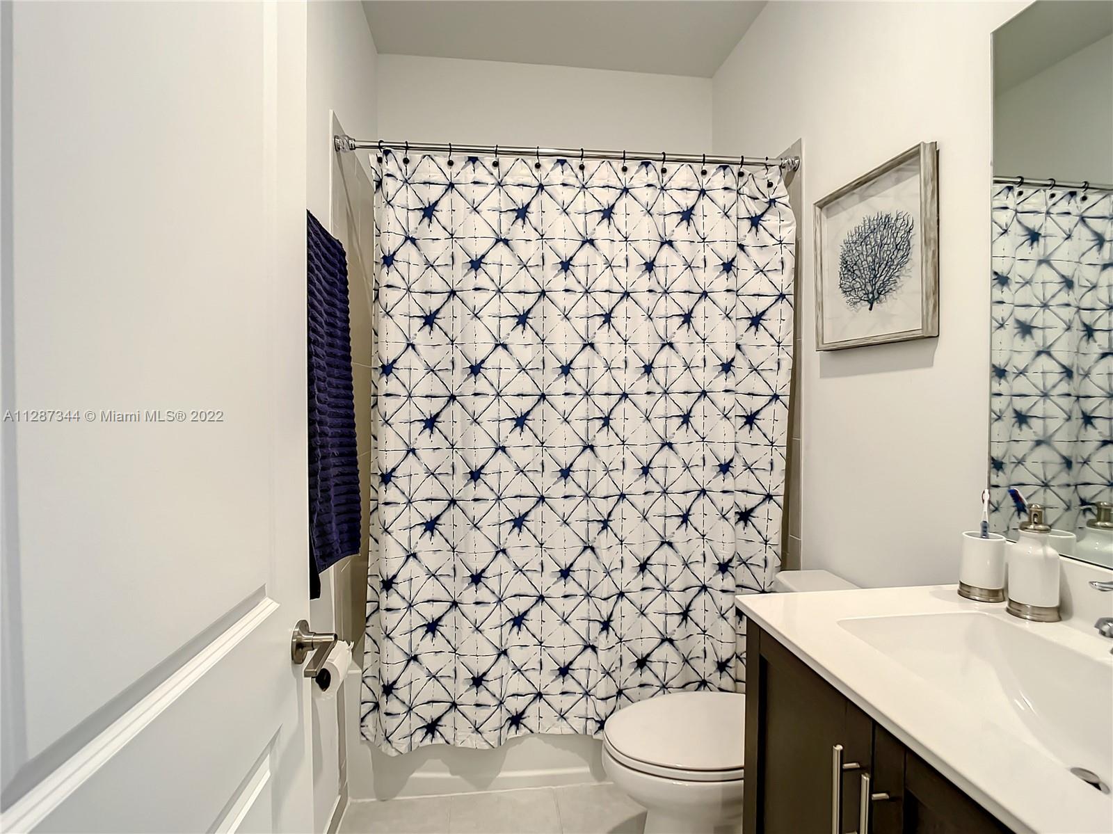 18272 Southwest 148th Road, Unit 18272 Miami, FL 33187 - Photo 12 of 19 a bathroom with a sink and a toilet