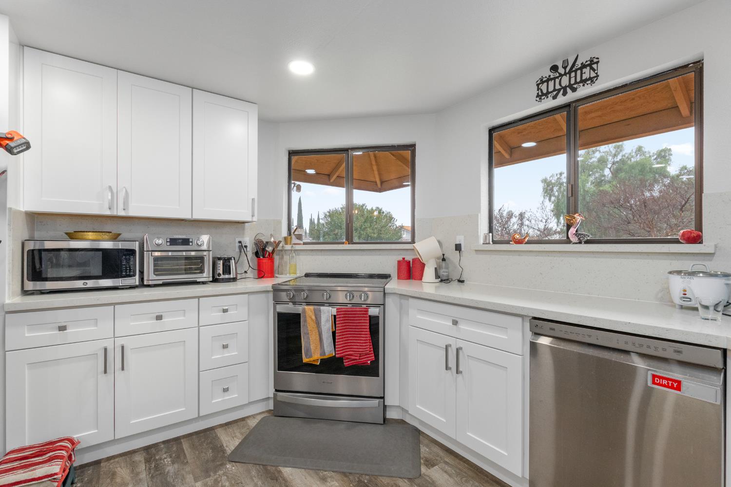 17188 Von Sosten Road Tracy, CA 95304 - Photo 12 of 39 a kitchen with white cabinets and window
