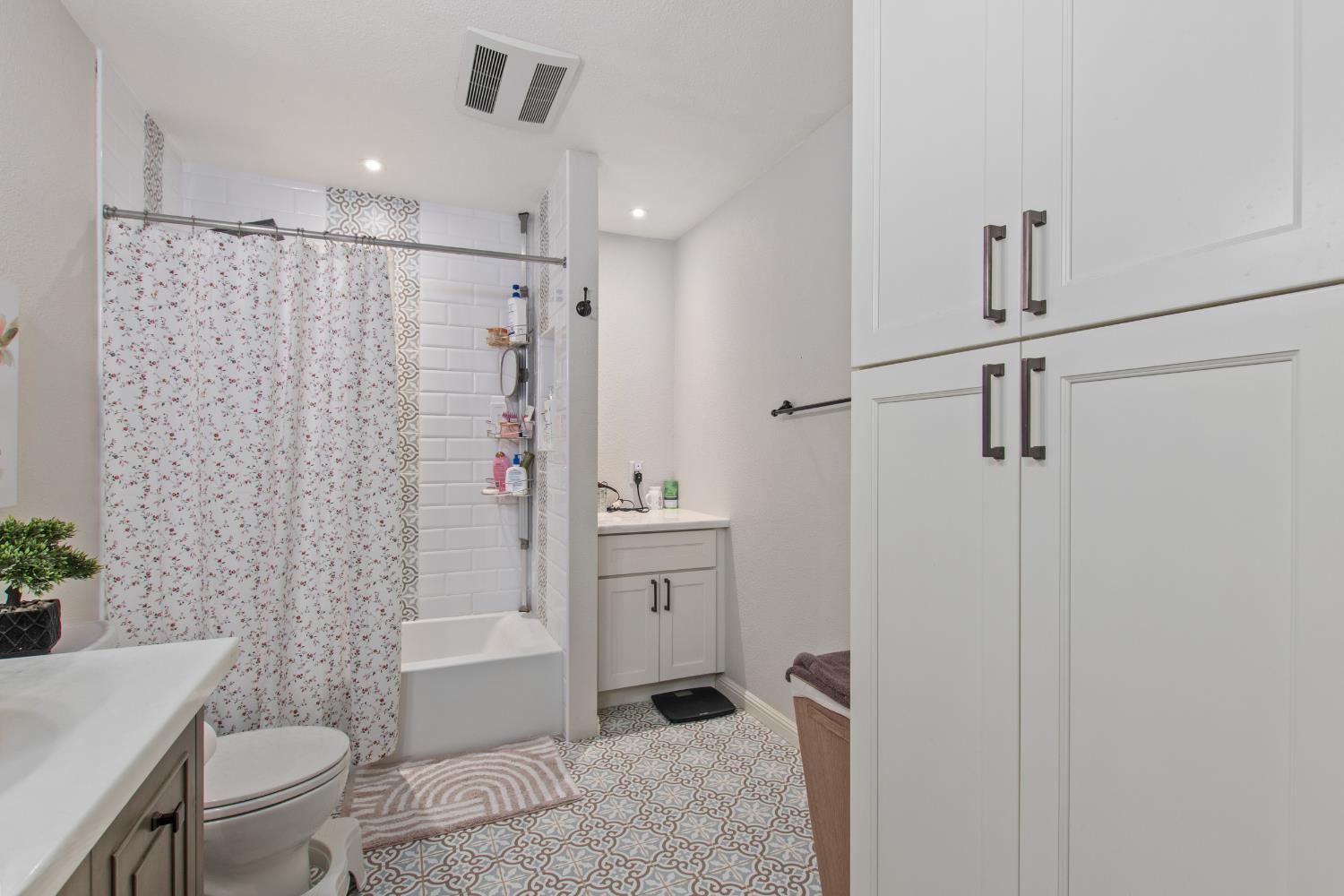 17188 Von Sosten Road Tracy, CA 95304 - Photo 20 of 39 a bathroom with a shower a toilet and sink