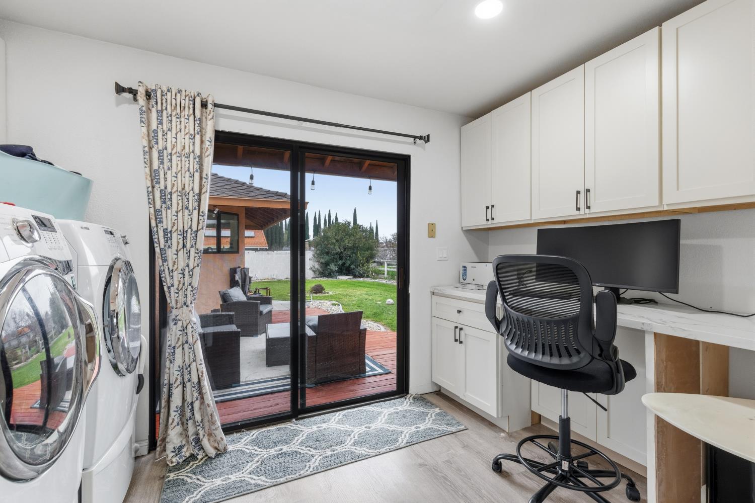 17188 Von Sosten Road Tracy, CA 95304 - Photo 23 of 39 a work room with furniture and a floor to ceiling window