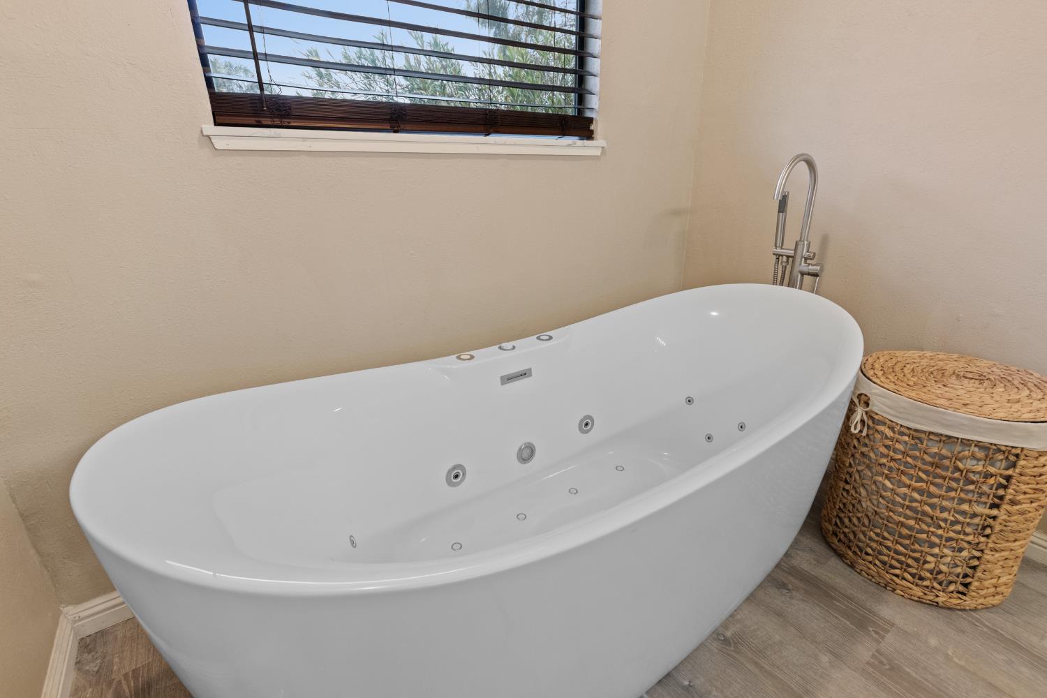 17188 Von Sosten Road Tracy, CA 95304 - Photo 30 of 39 a white bath tub sitting next to a white sink