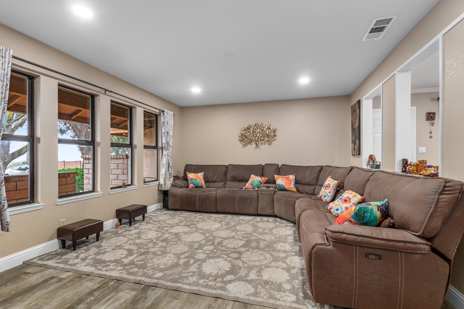 17188 Von Sosten Road Tracy, CA 95304 - Photo 3 of 39 a living room with furniture and large windows