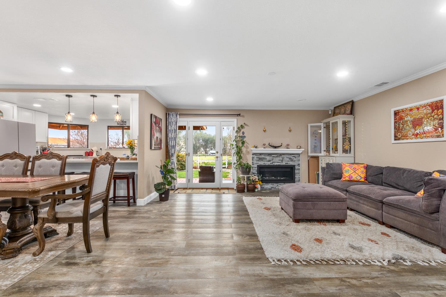17188 Von Sosten Road Tracy, CA 95304 - Photo 5 of 39 a living room with furniture a fireplace and a table