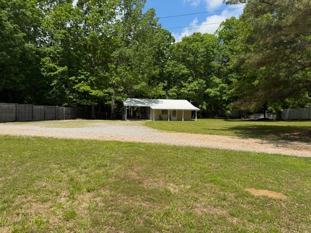 108 Hunters Lane Hohenwald, TN 38462 - Photo 5 of 16 a view of a swimming pool with a yard