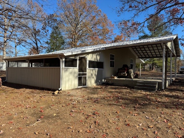 108 Hunters Lane Hohenwald, TN 38462 - Photo 6 of 16 a view of a house with a large tree in a yard