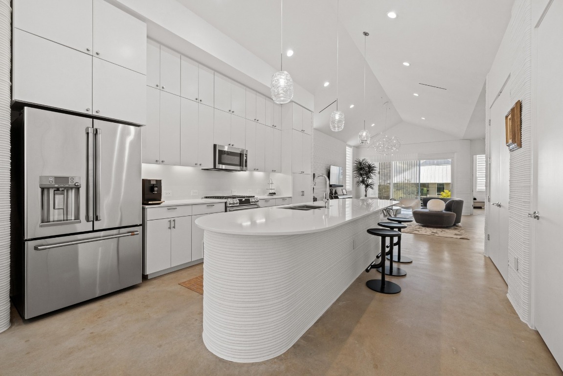 213 Lone Ranger Trail Georgetown, TX 78628 - Photo 11 of 26 a kitchen with refrigerator and cabinets