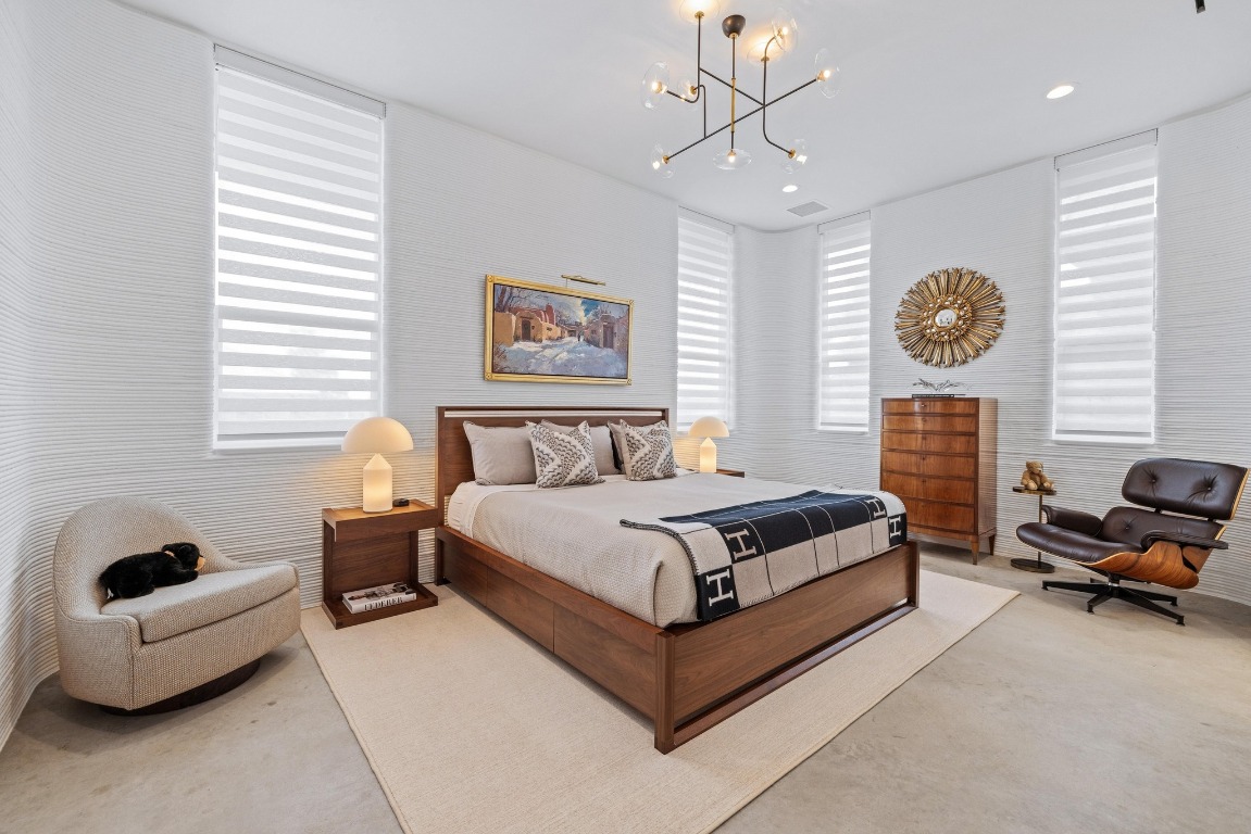 213 Lone Ranger Trail Georgetown, TX 78628 - Photo 16 of 26 a spacious bedroom with a bed and a couch