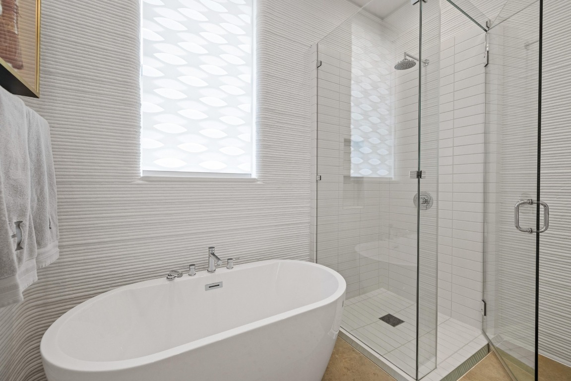 213 Lone Ranger Trail Georgetown, TX 78628 - Photo 18 of 26 a white bath tub sitting next to a white sink