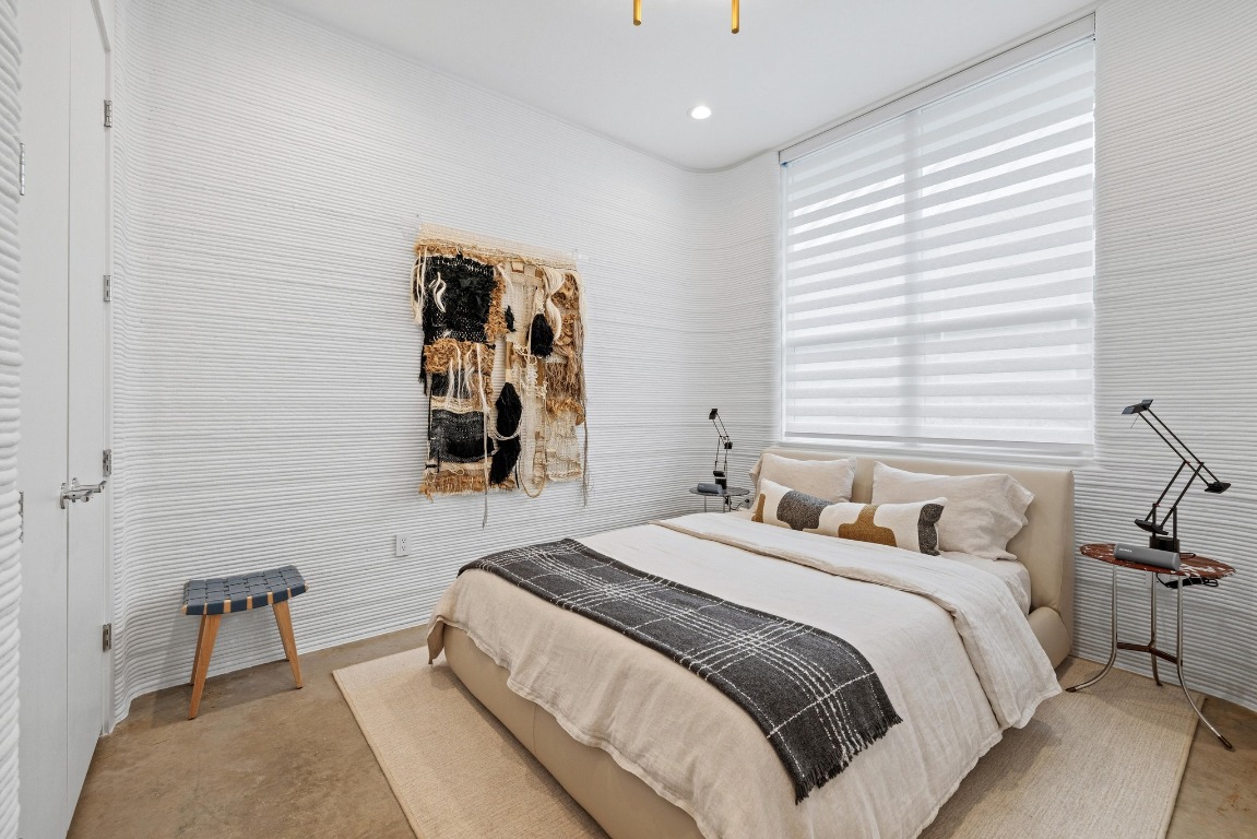 213 Lone Ranger Trail Georgetown, TX 78628 - Photo 19 of 26 a bedroom with a bed and a window