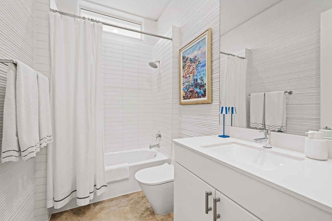 213 Lone Ranger Trail Georgetown, TX 78628 - Photo 21 of 26 a bathroom with a sink a toilet and shower