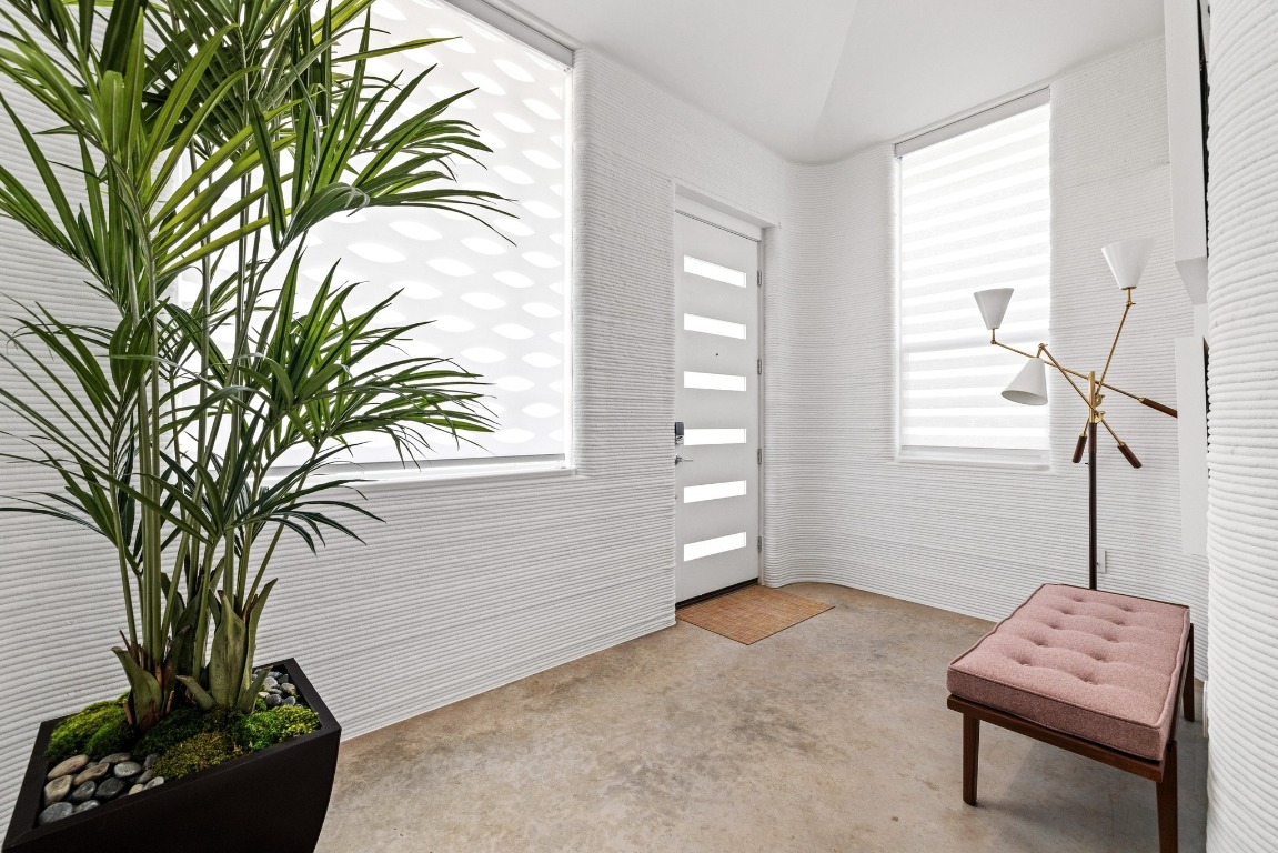 213 Lone Ranger Trail Georgetown, TX 78628 - Photo 3 of 26 a living room with furniture and a potted plant