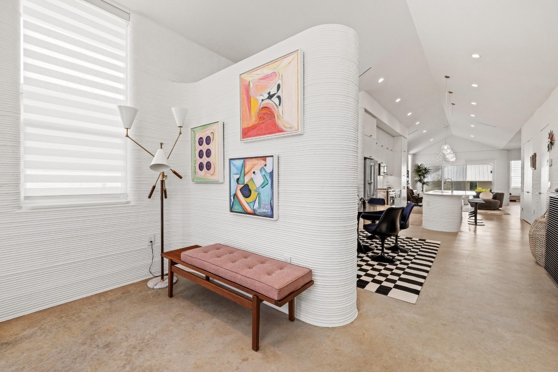 213 Lone Ranger Trail Georgetown, TX 78628 - Photo 4 of 26 a hallway with a table and a piano