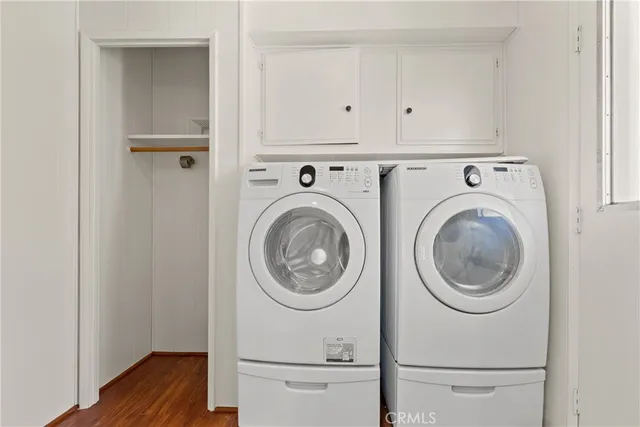 a view of a hallway with washer and dryer
